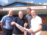 Civil Contractor - Graham Sayer, MCC Vice-President - Phil Simmons, Building Contractor - Ross Meneely & Architect - Norman Richards check plans for the Maleny Community Centre redevelopment